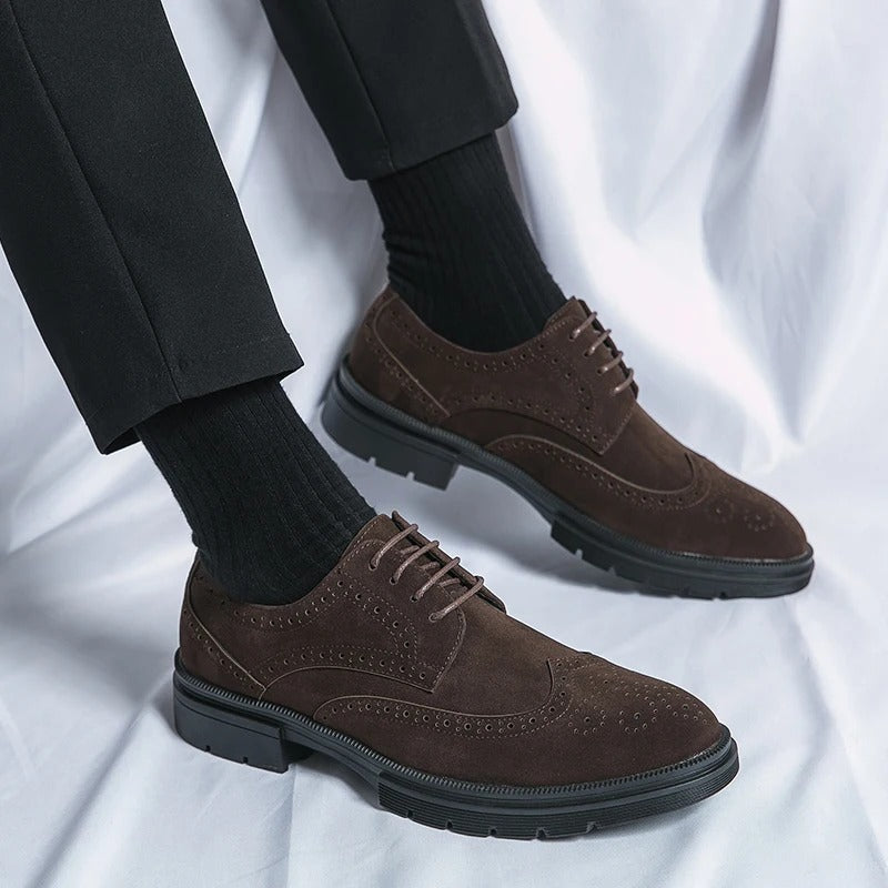 Comfortable men's brown suede dress shoes, featuring a timeless brogue style and lace closure.