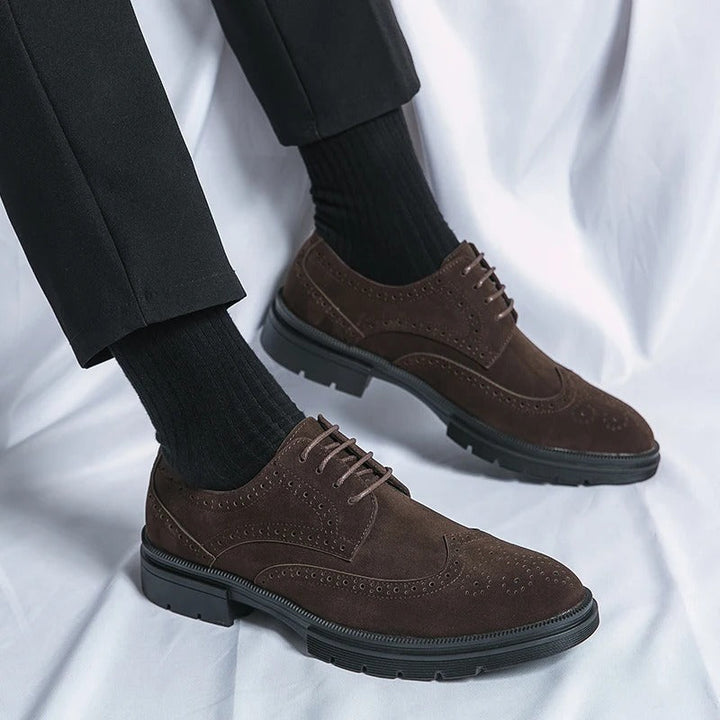Comfortable men's brown suede dress shoes, featuring a timeless brogue style and lace closure.