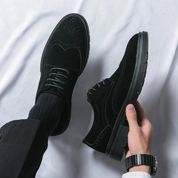 Pair of black suede brogue shoes, designed for men seeking comfort and classic style.