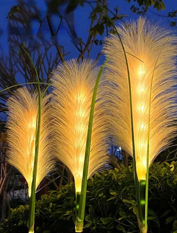 Close-up of Decorative Outdoor Reed Garden Lights glowing at dusk, perfect for pathway lighting.