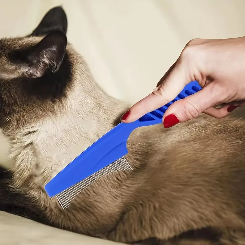 Close-up of metal fine-tooth flea comb, part of a pet flea & tick comb set for dogs and cats