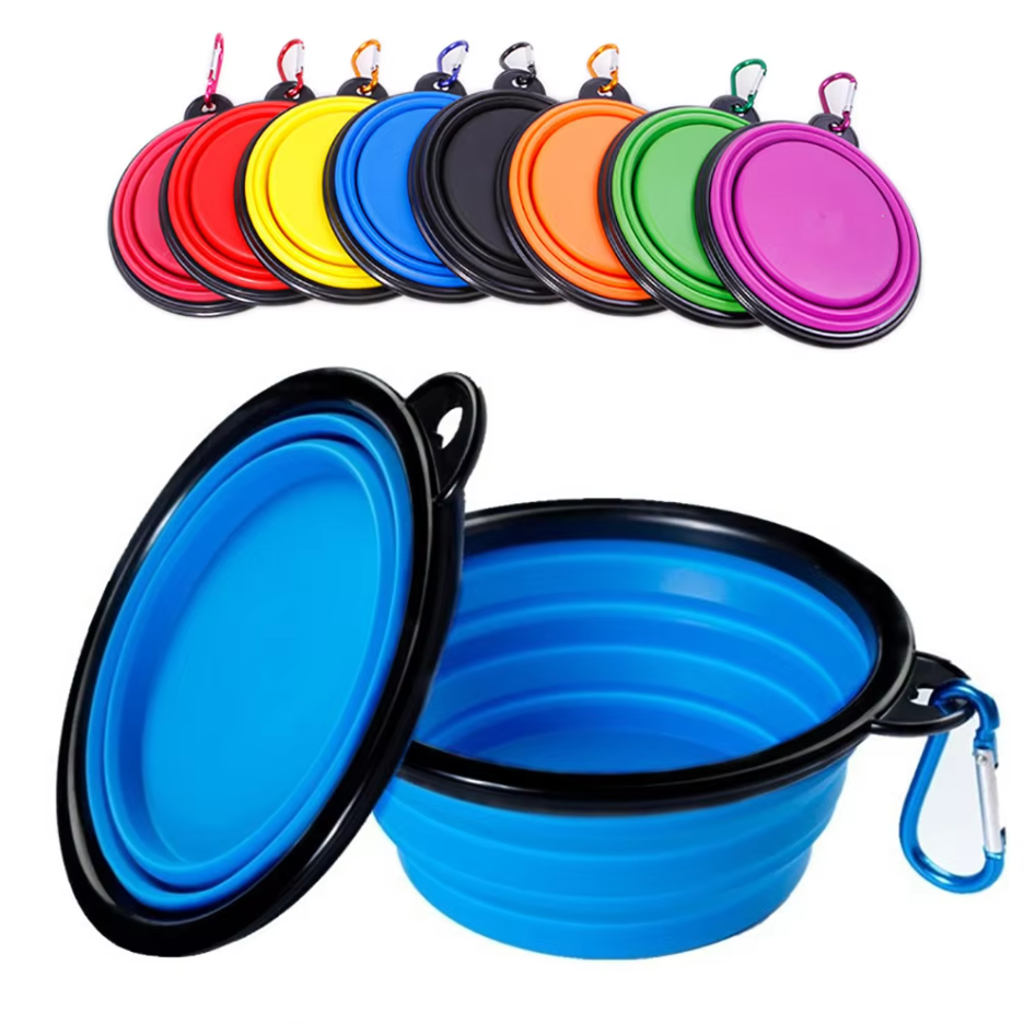 Yellow collapsible dog bowl made of silicone, with black carabiner, essential pet travel gear