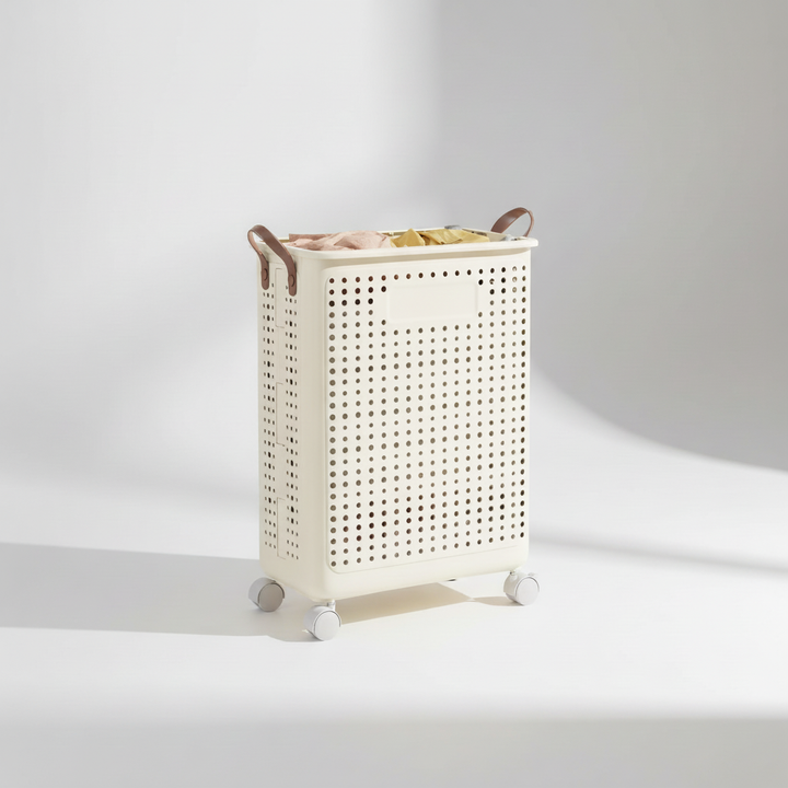 Cream wheeled laundry basket, collapsible & movable, simplifies dirty clothes transport and home organization.