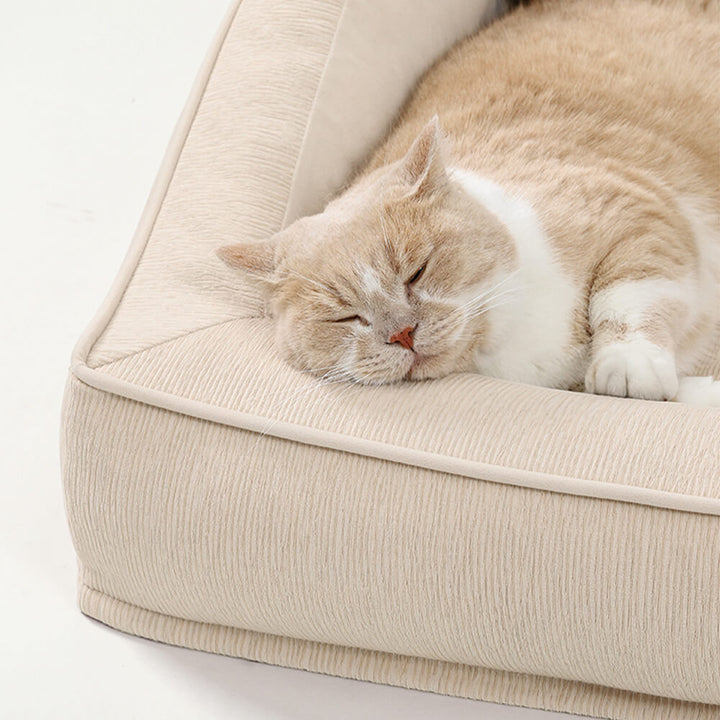 Dog resting on the Comfort Orthopedic Pet Sofa Bed with Pillows, showcasing ample space.