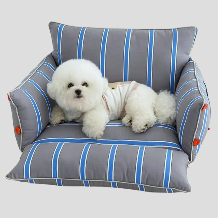 Premium dog bed with elevated edges for head and neck support, a comfy pet accessory for any home.