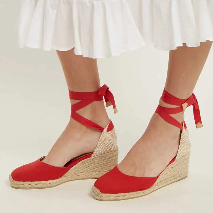 Elegant black women's ankle strap sandals with an open toe, ideal for stylish summer outfits & comfortable wear.