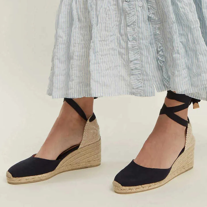 Versatile white women's ankle strap sandals, chic and comfortable open-toe flat footwear for summer elegance.