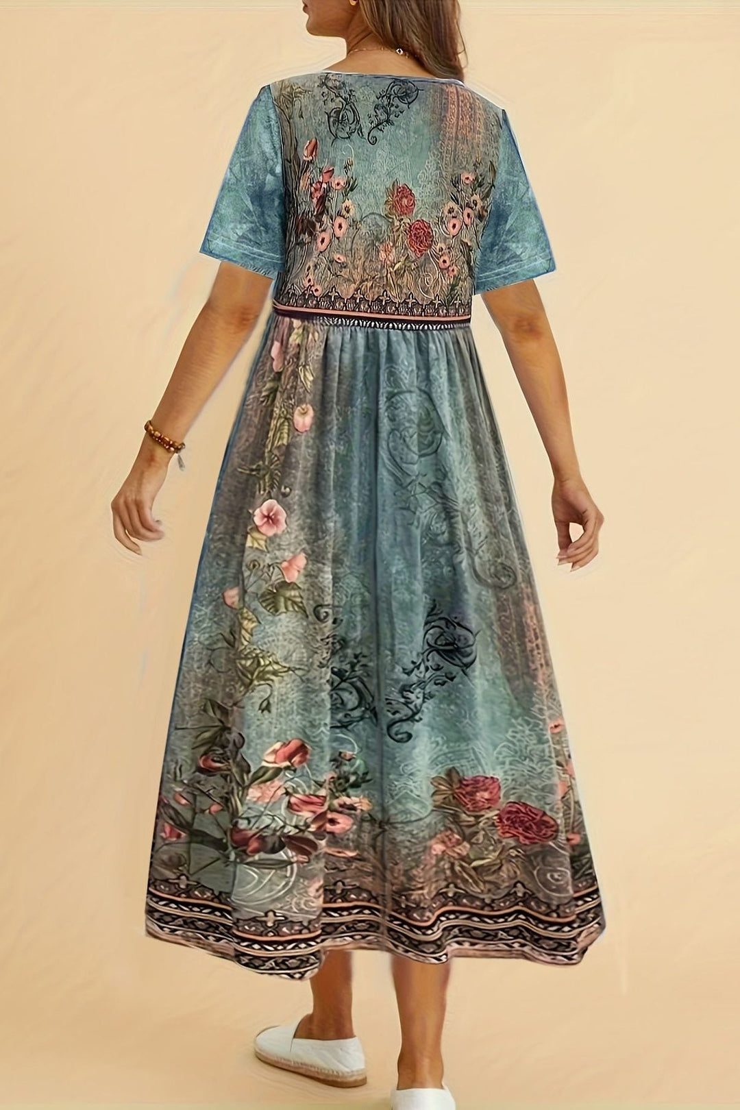 Elegant printed midi dress for women, offering effortless style and a comfortable relaxed fit for any day.