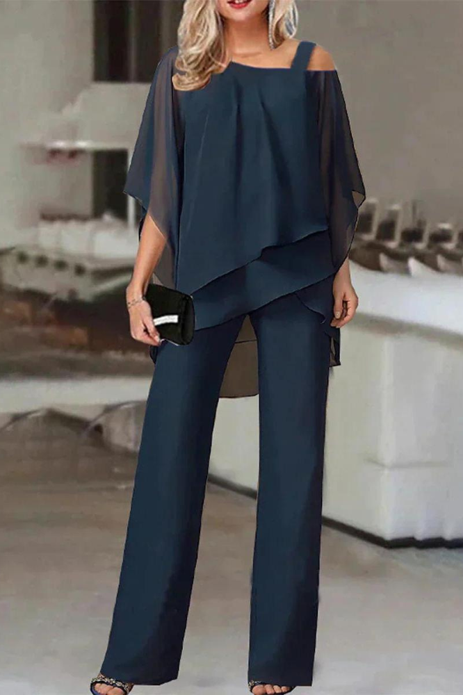 Comfortable women's two-piece blouse and pants set for versatile everyday wear.