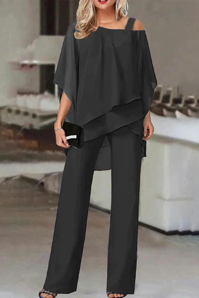 Stylish women's blouse and pants matching set, perfect for office or casual elegant outfits.