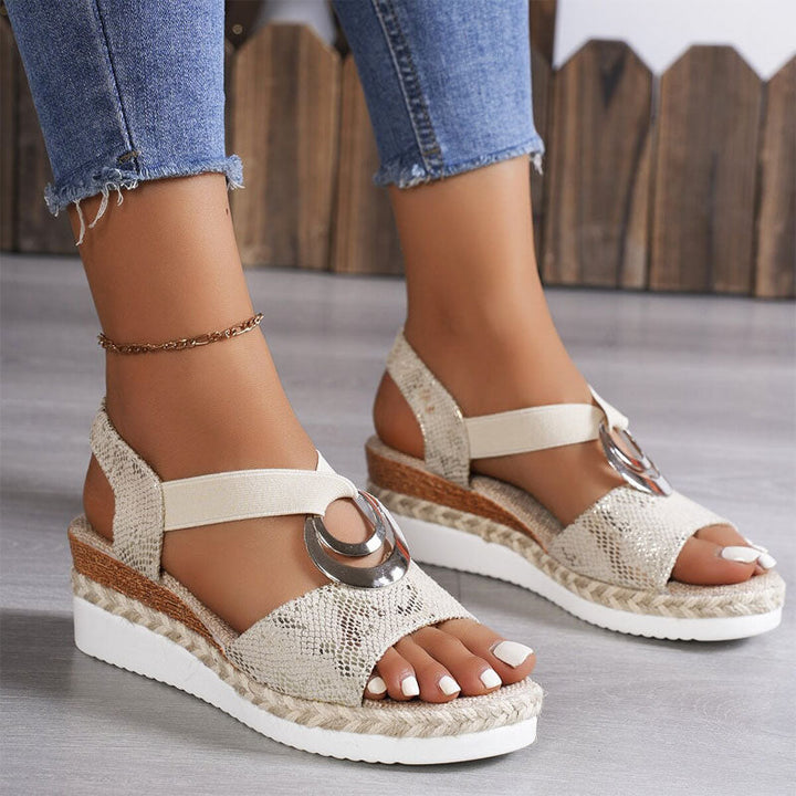 Women's open-toe wedge sandals featuring elastic strappy design & platform for comfortable summer footwear.