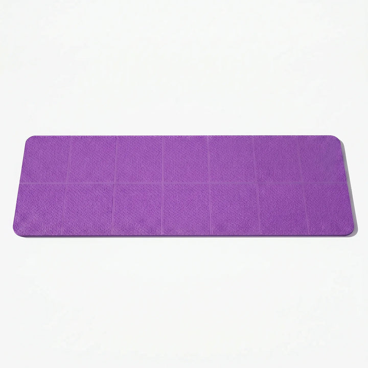 Lightweight unisex travel yoga mat, perfectly folded for easy portability & daily exercise.