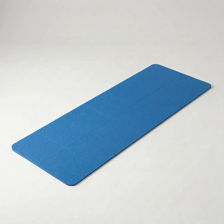 Unisex fitness mat in use, demonstrating its stability & grip during a yoga pose on-the-go.