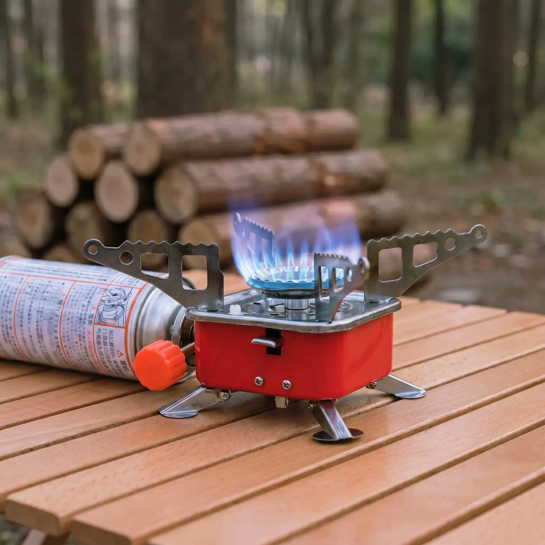 Compact folding camping stove for easy transport & outdoor cooking. Ideal for hiking & backpacking meals.