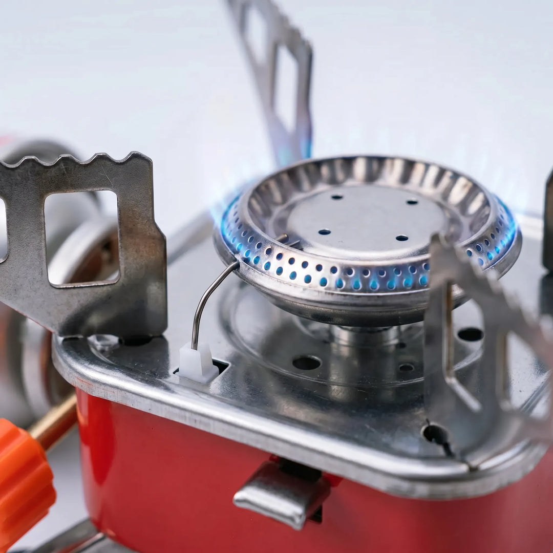 Versatile folding camping stove, essential portable gear for any camp kitchen & outdoor cooking adventure.