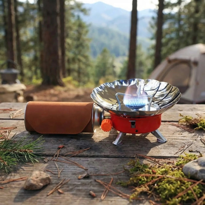 Compact folding camping stove, windproof design for outdoor cooking & backpacking. Portable burner for camp kitchen.