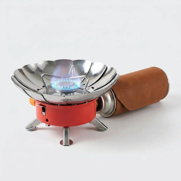 Portable hiking stove with folding design, ideal for backpacking, outdoor cooking, and survival gear. Compact burner.