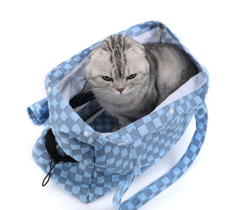 Enclosed pet travel accessory, a compact and practical cat or dog carrier for vehicles