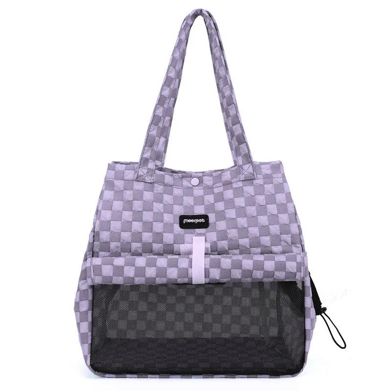 Small dog carrier for cars with breathable mesh, ensuring pet comfort during travel