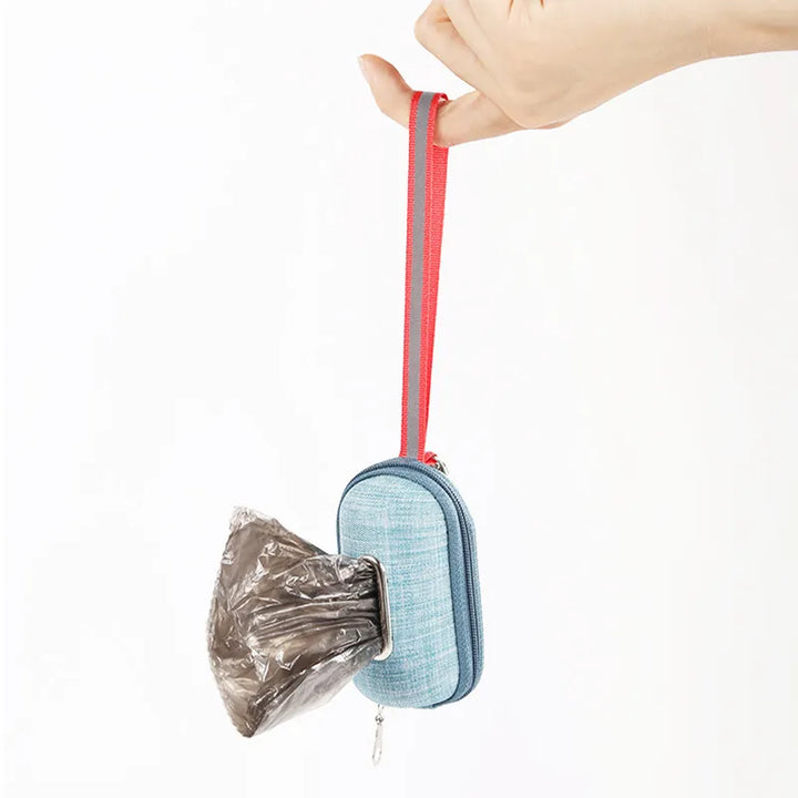 Stylish pet waste bag dispenser, red, showing dog bags accessible, practical for pet owners on walks