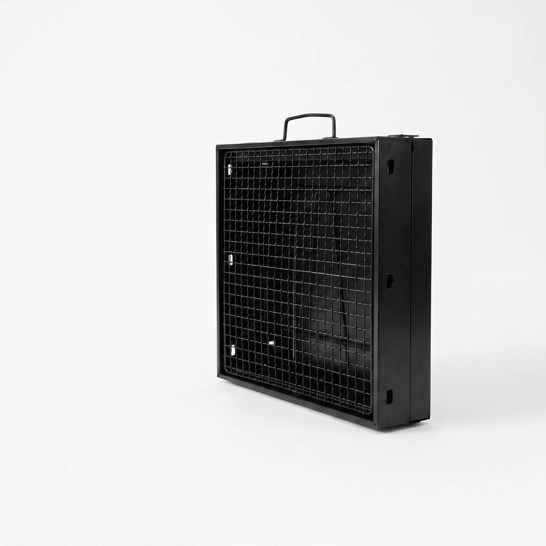 Portable charcoal BBQ grill in use, cooking delicious food outdoors, ideal for camping and garden parties.
