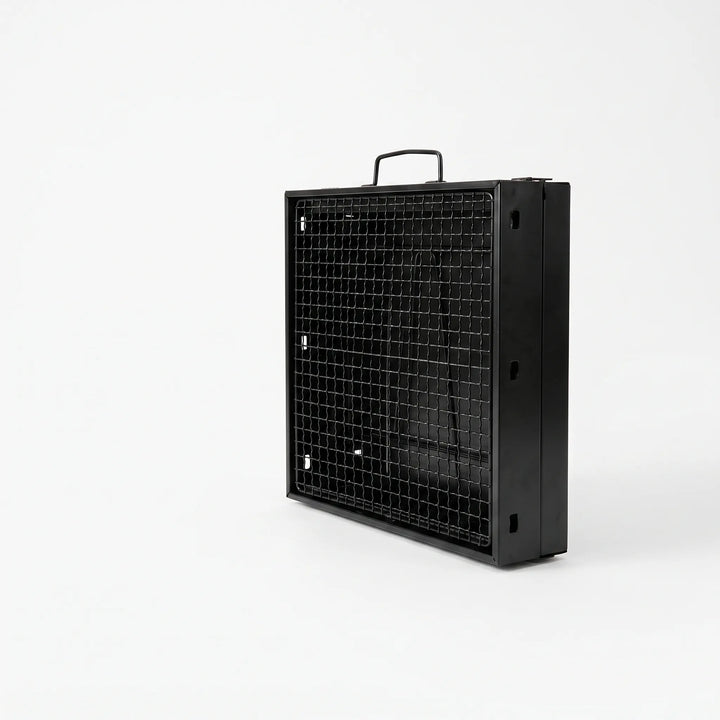 Portable charcoal BBQ grill in use, cooking delicious food outdoors, ideal for camping and garden parties.