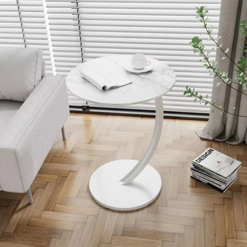 Space-saving round side table, a stylish nightstand for small bedrooms.