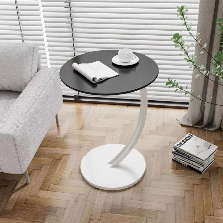 Modern compact round table, contemporary design for versatile home use.