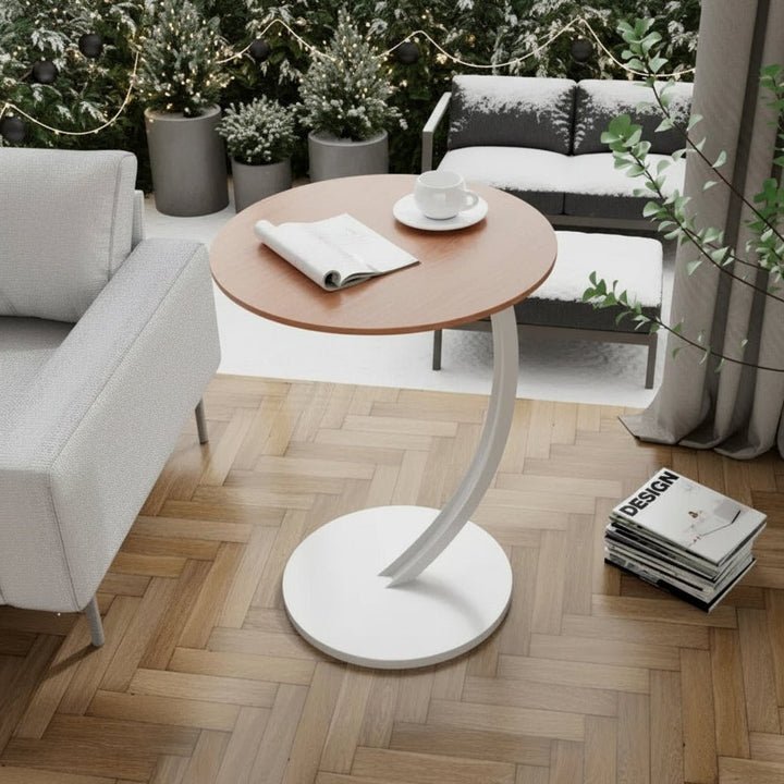 Sleek round living room side table, minimalist and functional design.