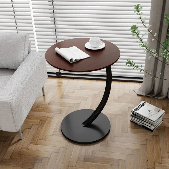 Modern compact round side table, great for space-saving furniture needs.
