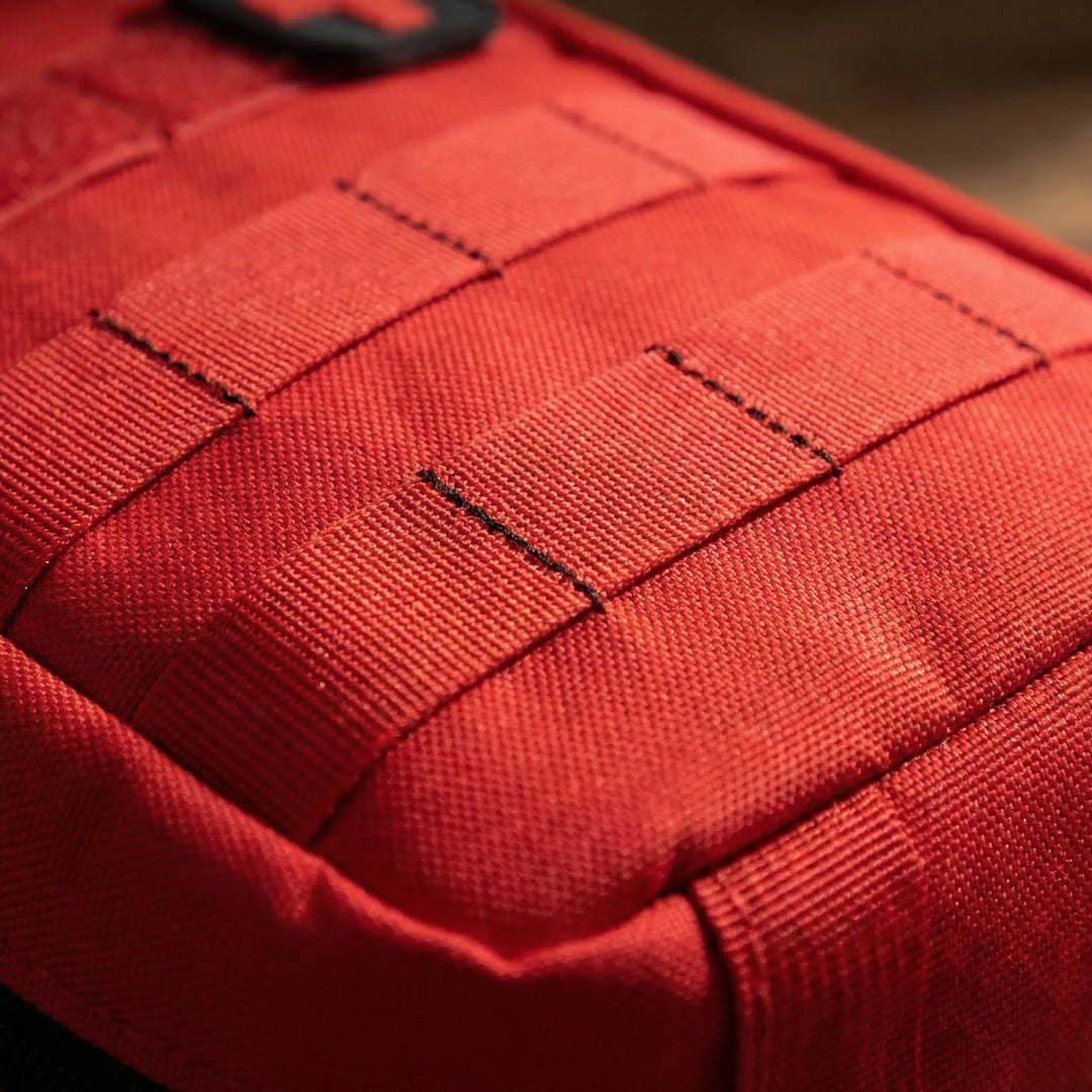 Compact utility first-aid pouch, essential travel & hiking accessory. Holds emergency medical supplies for outdoor use.