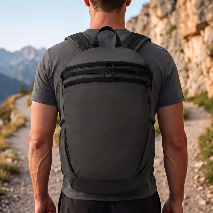 Compact unisex foldable travel backpack in a vibrant color, perfect for light trips & easy storage.