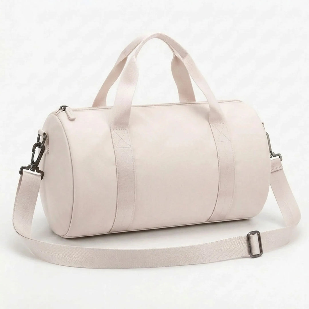 Cylindrical nylon compact gym duffel bag with easy access storage for daily essentials & sport gear.