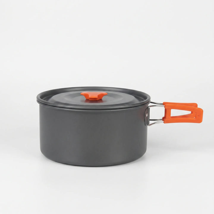 Portable camping cookware set packed for backpacking, essential camp kitchen gear for outdoor adventures.