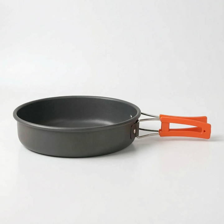 Durable camping cookware, including pots and pans, suitable for versatile outdoor and trail cooking needs.