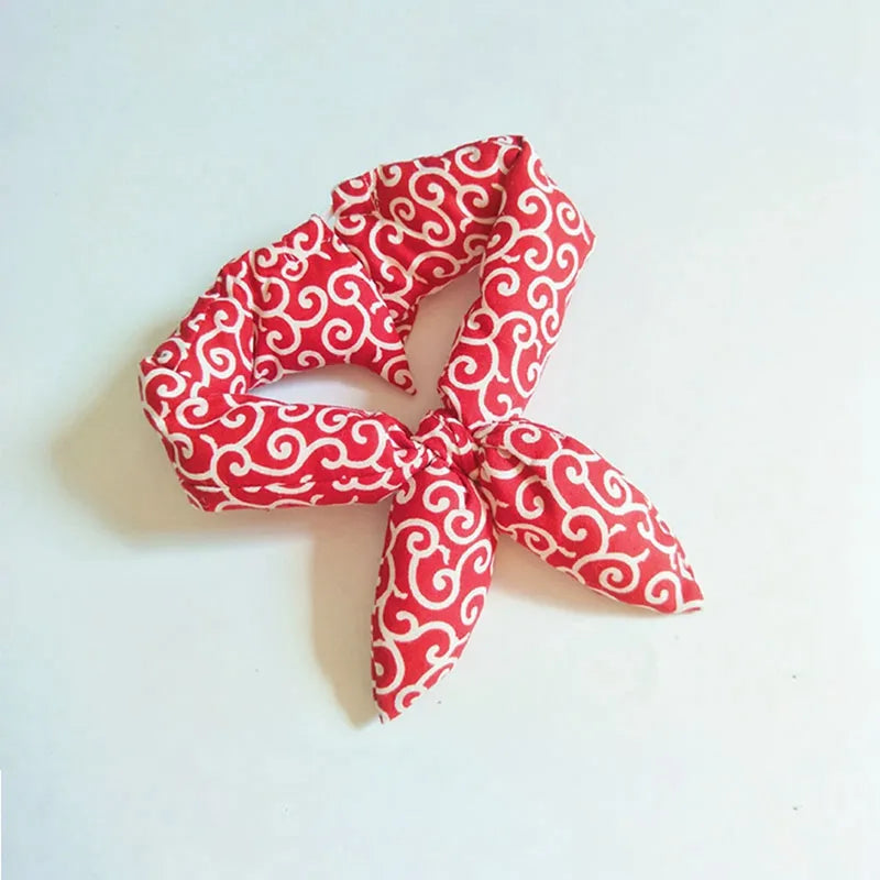 Brightly colored cooling dog bandana with a unique traditional pattern, great for pet cooling.