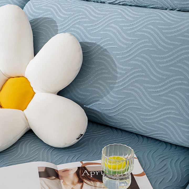 Elastic band and anti-slip backing of the stretch sofa cover, ensuring a snug fit on furniture