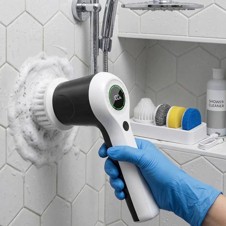 Cordless electric power scrubber efficiently cleaning dirty tile grout lines in a bathroom.