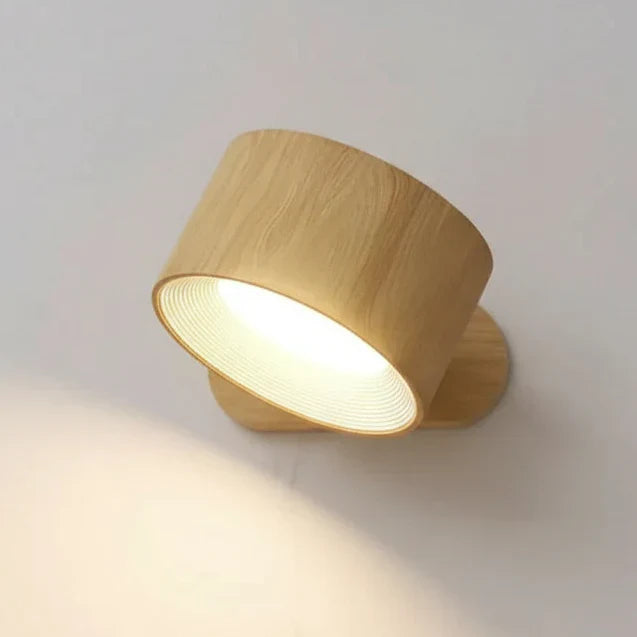 Cordless LED wall light with magnetic base & pivoting head. Rechargeable & dimmable for modern homes.