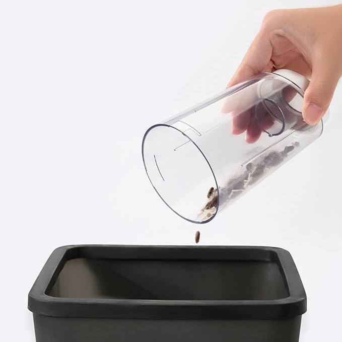 Cordless pet hair vacuum in action, showing collected pet hair in the dustbin