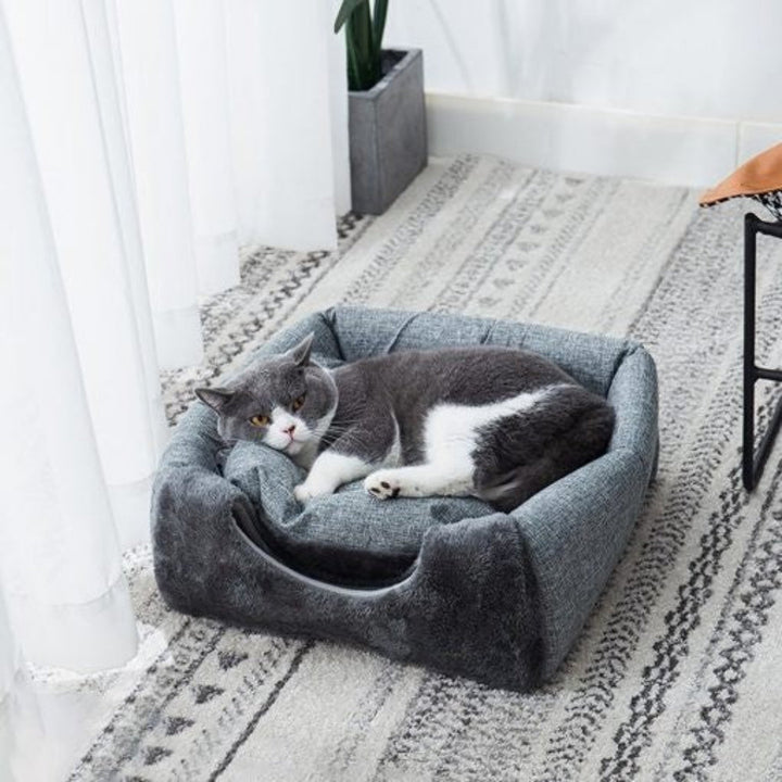 Cozy 2-in-1 cat cave and lounger bed in soft gray fleece, perfect for small pets, washable for easy care.