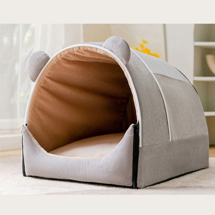 Beige 2-in-1 pet cave bed for dogs and cats, featuring playful bear ears and a removable cushion for easy cleaning.