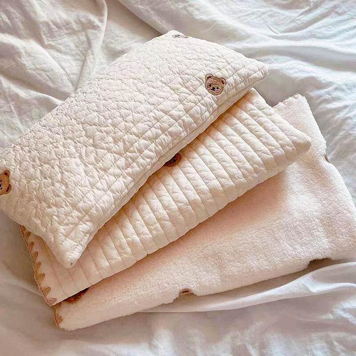 Luxury pet bedding with animal embroidery; a washable cotton dog bed, pillow, & quilt
