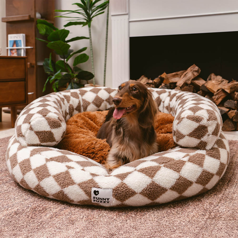 Cozy argyle washable donut dog bed in a living room setting, perfect for small pets.