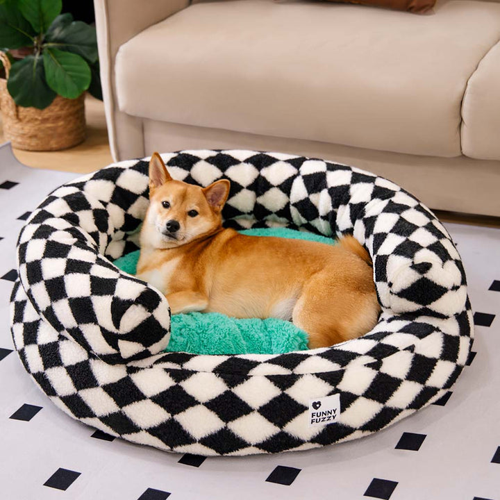 Plush argyle pet bed, a warm and inviting donut shape for cats and dogs.