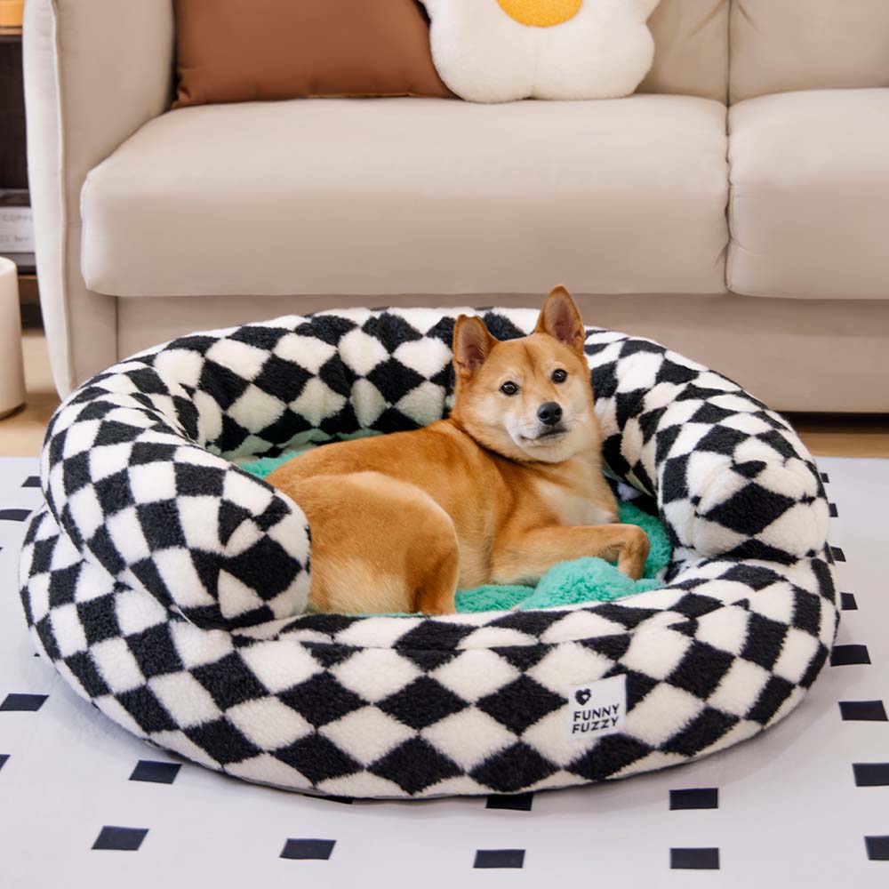 Luxury argyle pet bed, a washable donut style for dogs who love to burrow.