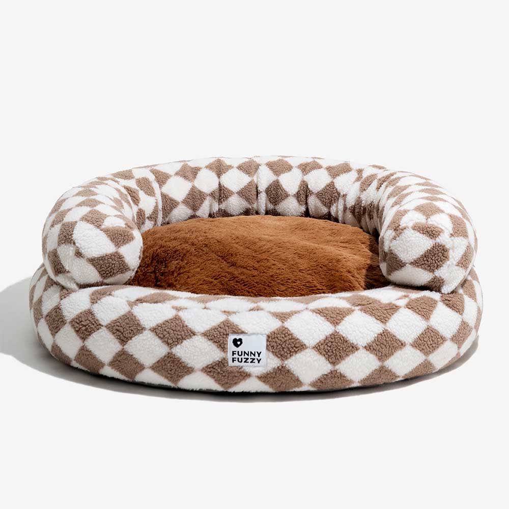 Argyle donut dog bed with a thick, supportive bolster, machine washable for hygiene.