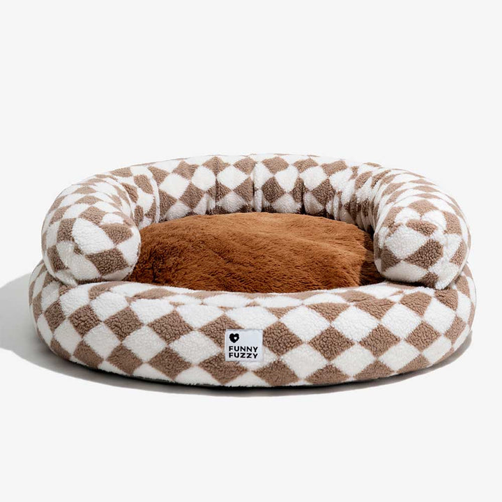 Argyle donut dog bed with a thick, supportive bolster, machine washable for hygiene.