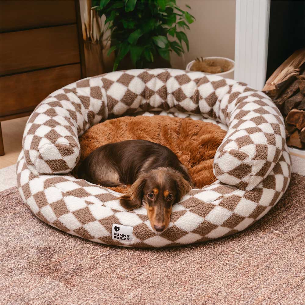 Washable donut dog bed featuring a classic argyle pattern, ideal for deep sleep.