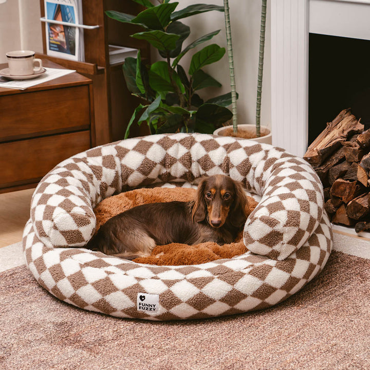 Argyle donut dog bed showing off its plush, removable cover for easy washing.